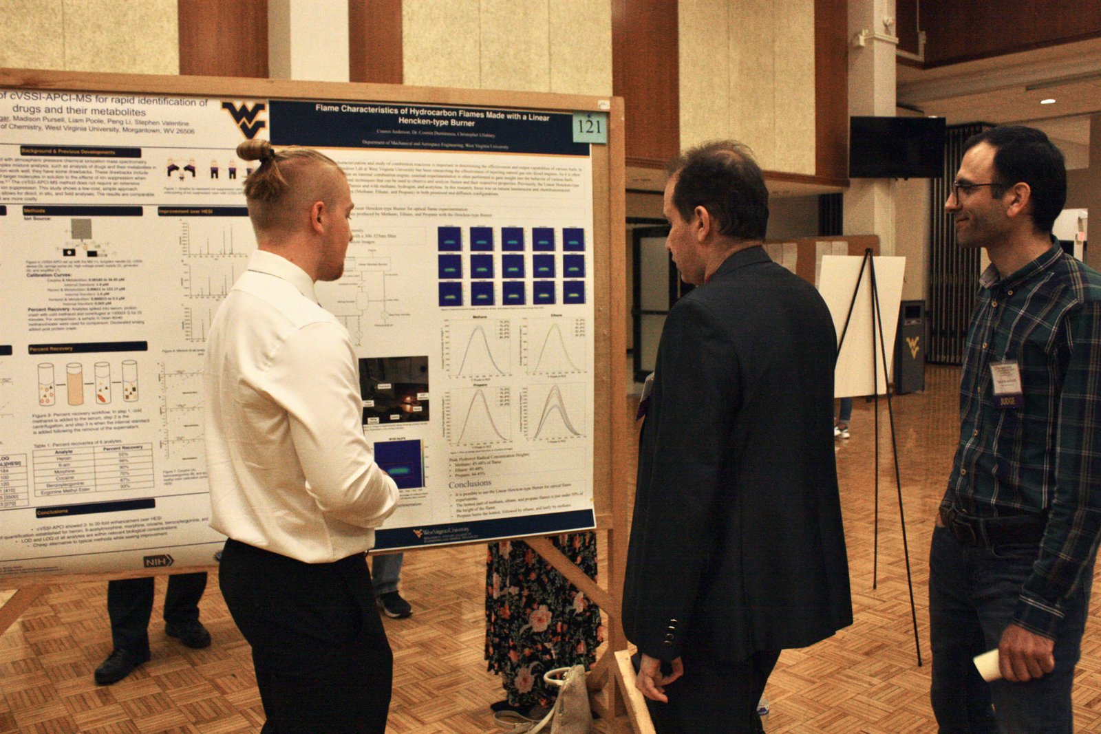 Habib Latifizadeh with a fellow judge and a student presenter at the WVU Undergraduate Research Symposium, 2023